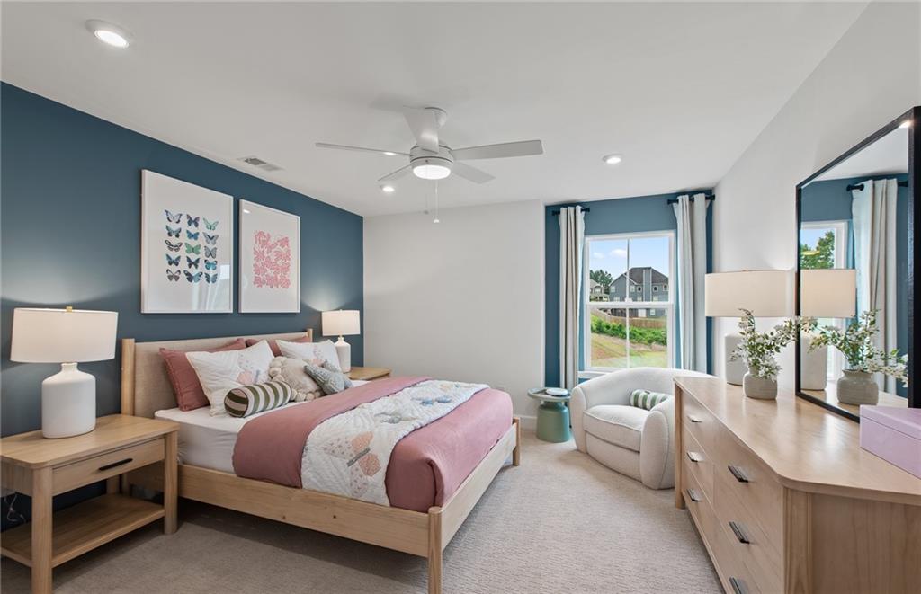 810 Tupelo Way Villa Rica, GA 30180 - Photo 29 of 41 a bedroom with a large bed and a couch