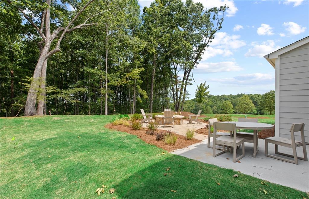 810 Tupelo Way Villa Rica, GA 30180 - Photo 35 of 41 a view of a tables and chairs in the garden