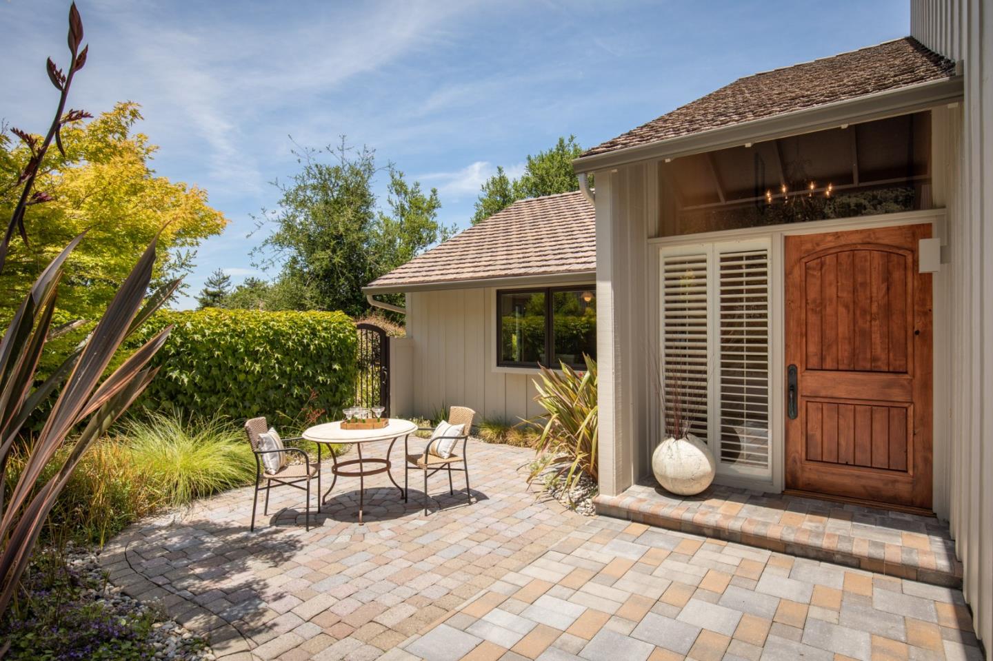 9546 Maple Court Carmel, CA 93923 - Photo 13 of 20 a backyard of a house with table and chairs