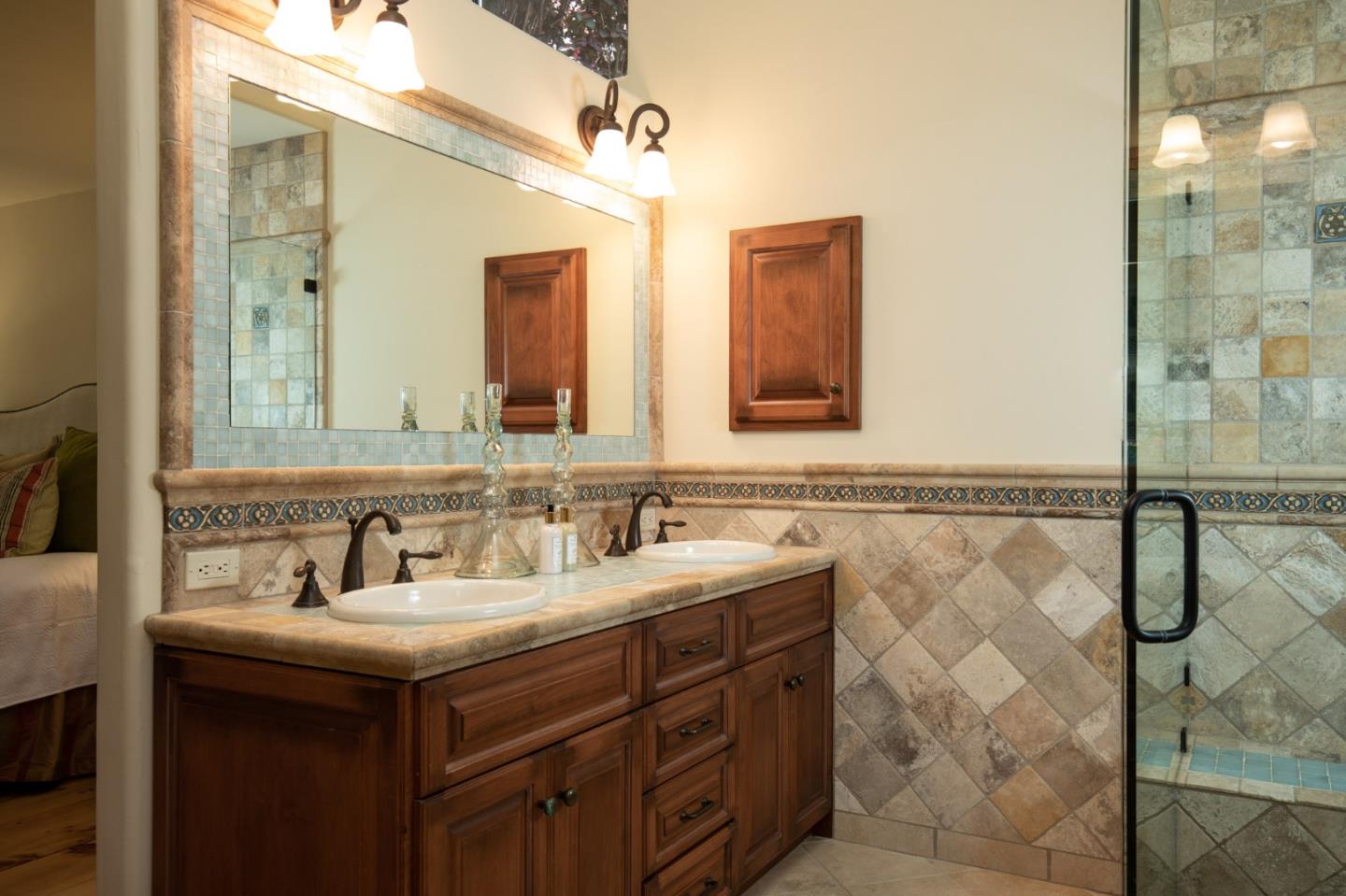 9546 Maple Court Carmel, CA 93923 - Photo 16 of 20 a bathroom with a double vanity sink mirror and
