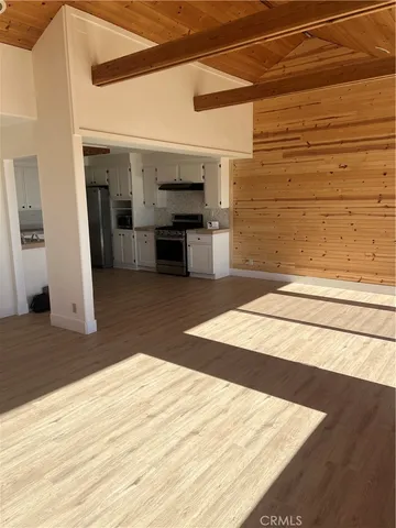 a kitchen with stainless steel appliances cabinets a sink and a stove