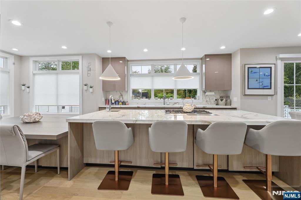31 Engleside Street Cresskill, NJ 07626 - Photo 11 of 49 a kitchen with a table and chairs in it