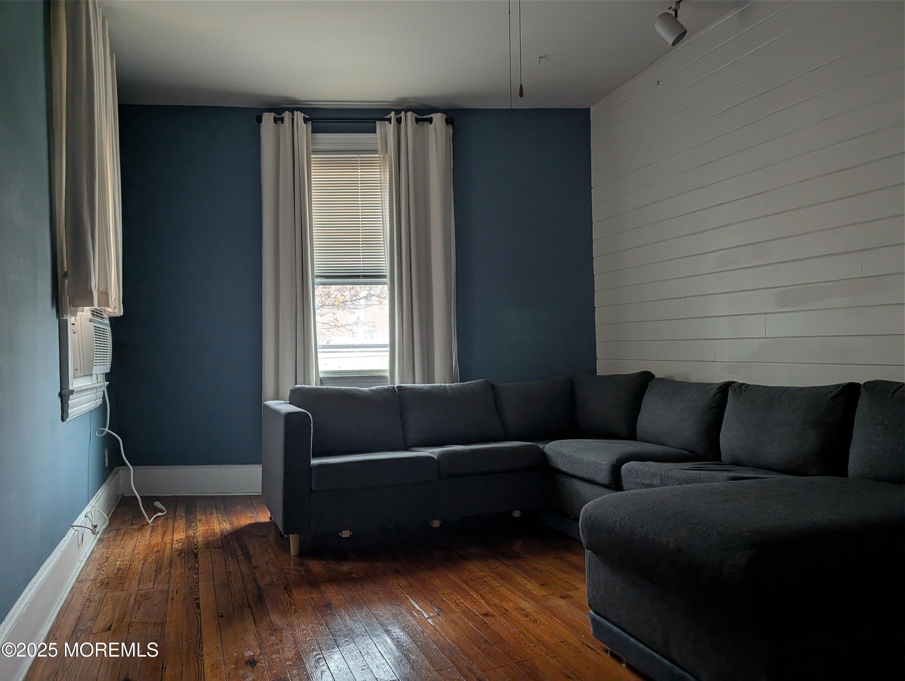 5 Wharf Avenue, Unit A Red Bank, NJ 07701 - Photo 2 of 7 a living room with furniture and a window