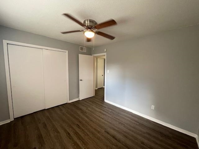 605 Patterson Street, Unit 9 Memphis, TN 38111 - Photo 7 of 10 an empty room with wooden floor fan and windows
