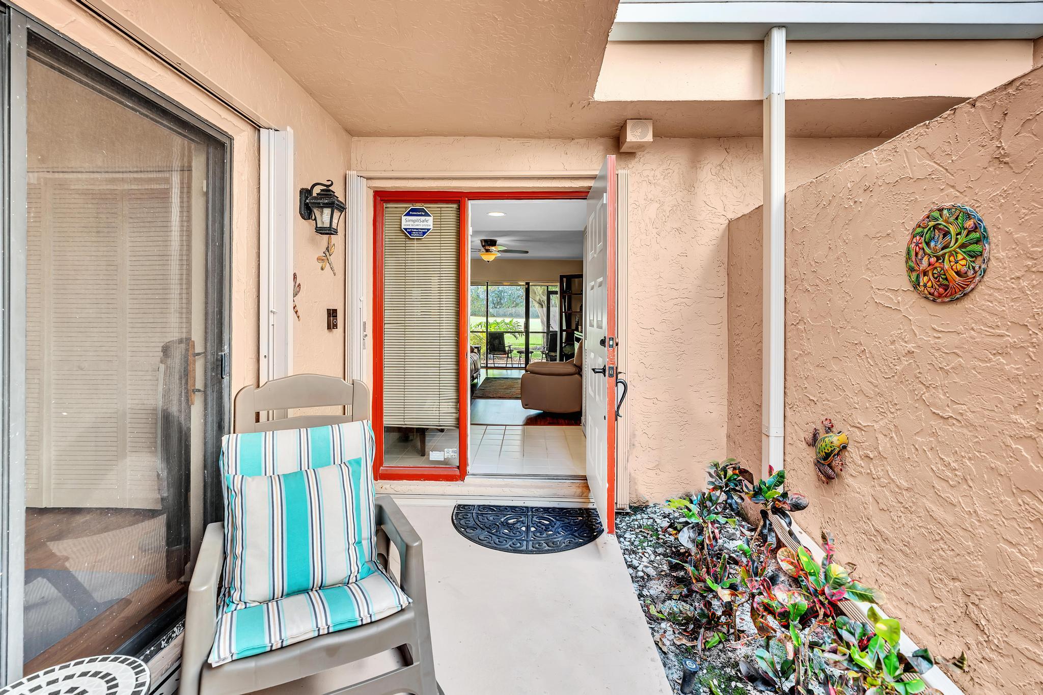 17372 Boca Club Boulevard, Unit 405 Boca Raton, FL 33487 - Photo 10 of 74 a front view of a house with outdoor seating and shower