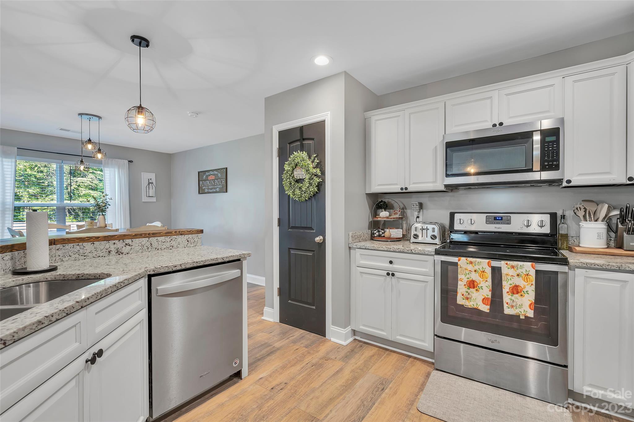 871 West Keepsake Lane Inman, SC 29349 - Photo 11 of 26 a kitchen with stainless steel appliances granite countertop a stove a sink and a microwave