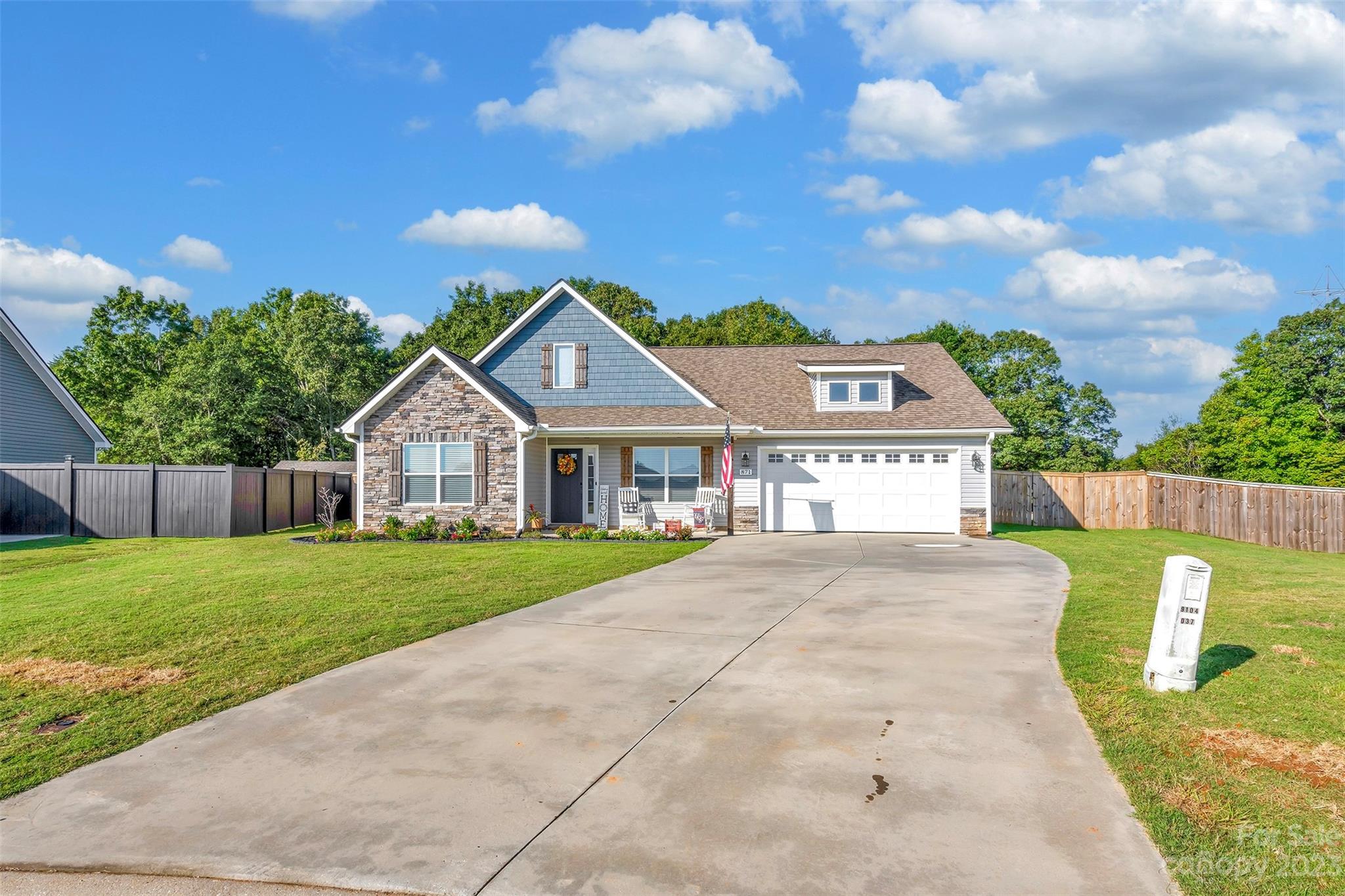 871 West Keepsake Lane Inman, SC 29349 - Photo 2 of 26 a front view of a house with a yard and trees