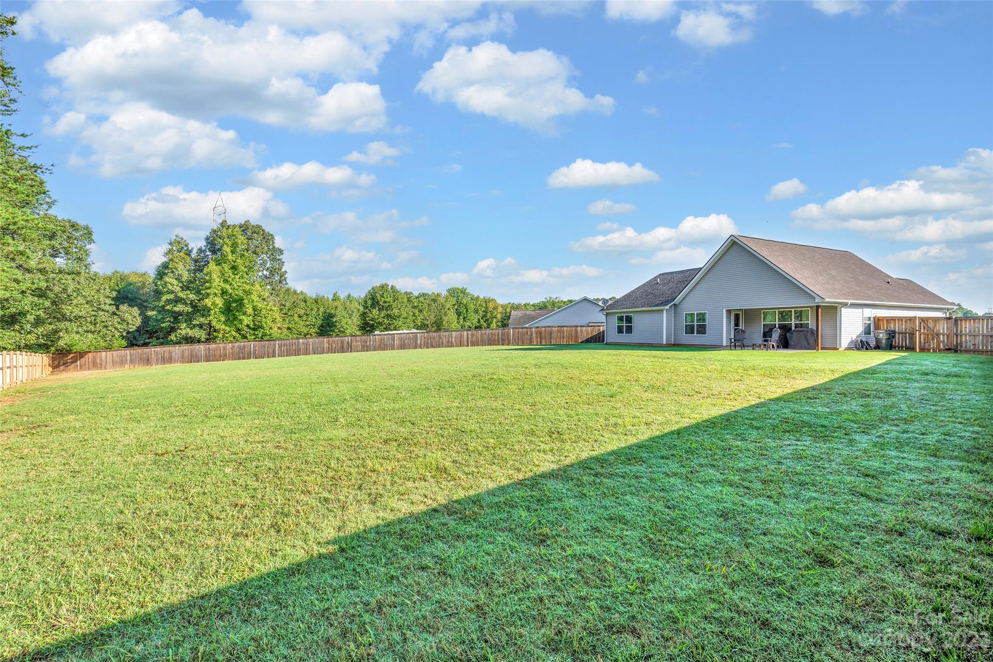 871 West Keepsake Lane Inman, SC 29349 - Photo 24 of 26 a view of an house with backyard and a big yard