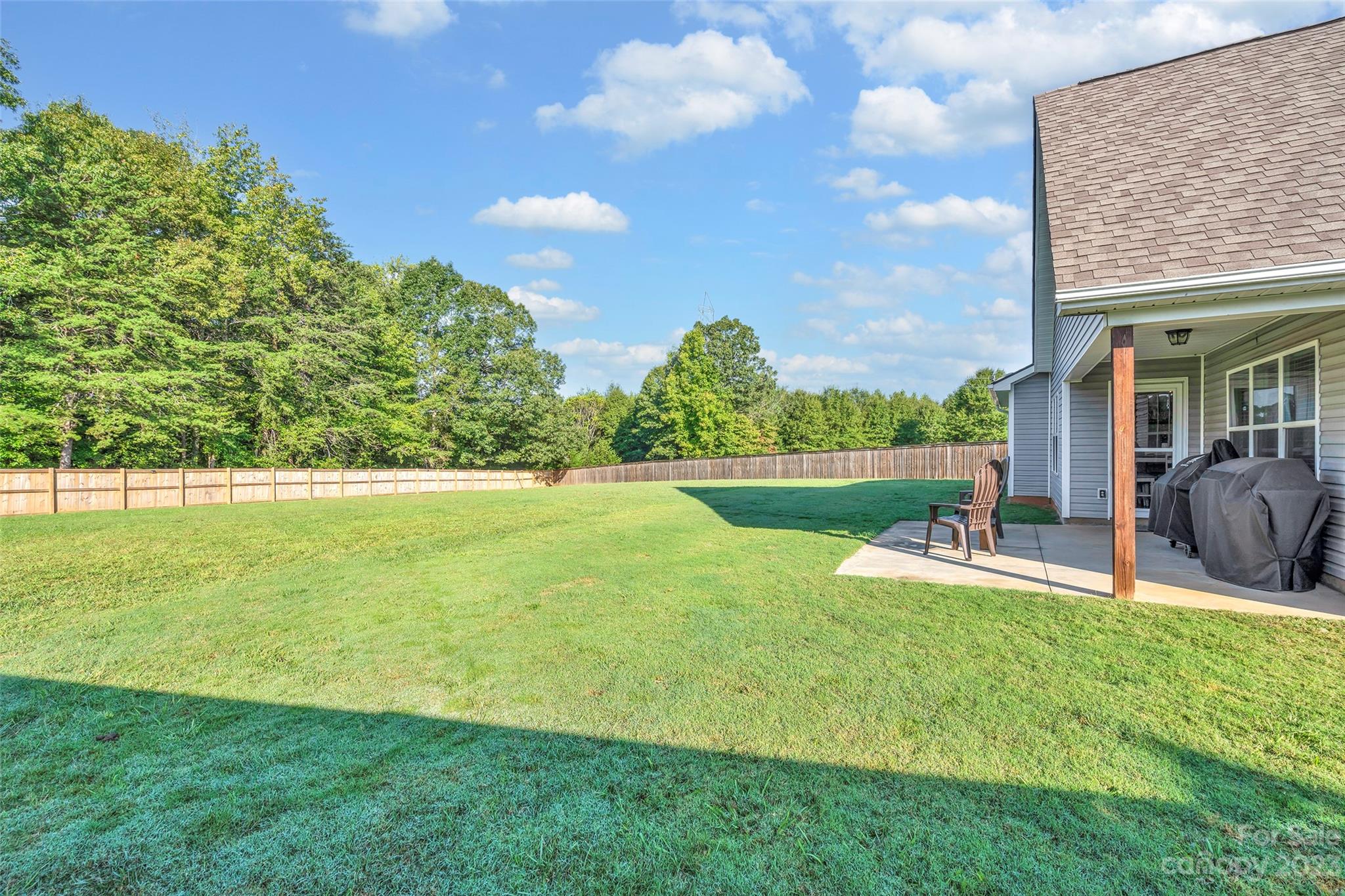 871 West Keepsake Lane Inman, SC 29349 - Photo 25 of 26 a view of a house with a yard potted plants and a large tree
