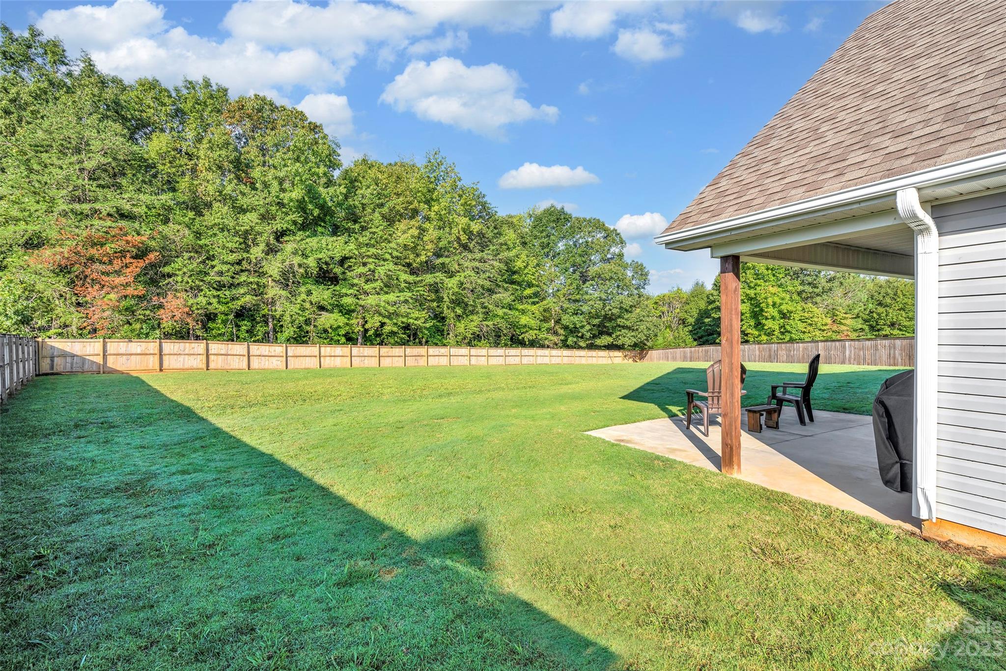 871 West Keepsake Lane Inman, SC 29349 - Photo 26 of 26 a view of a backyard with a garden and plants