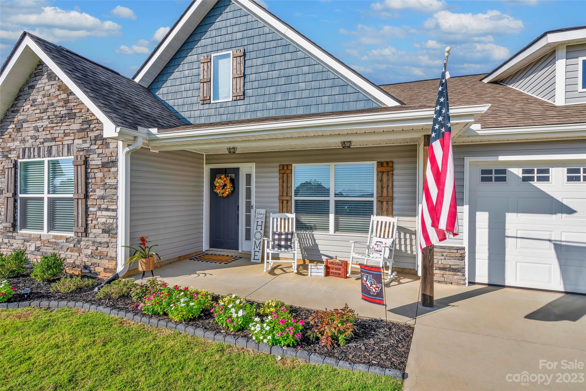 871 West Keepsake Lane Inman, SC 29349 - Photo 3 of 26 a front view of a house with garden