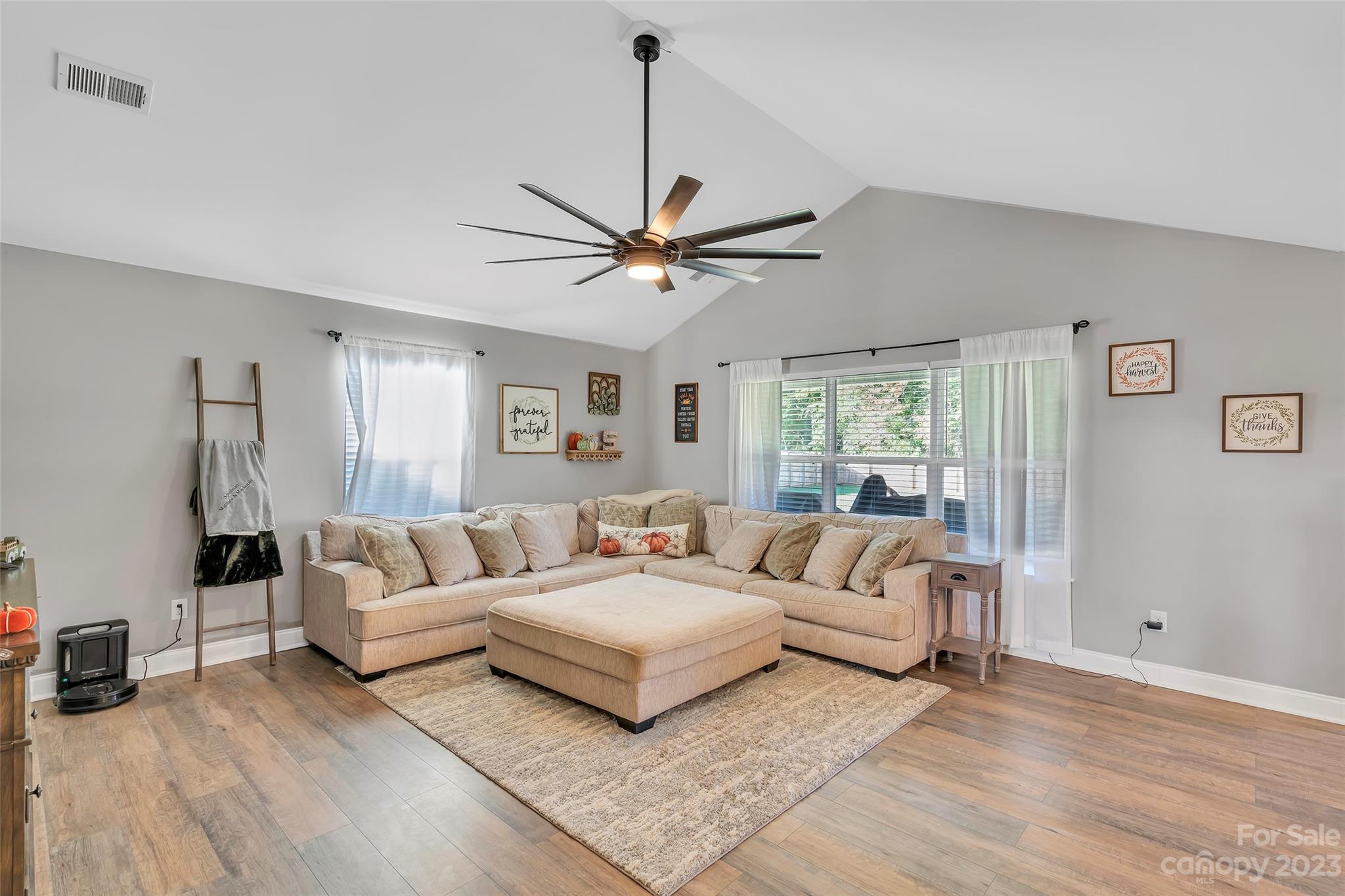 871 West Keepsake Lane Inman, SC 29349 - Photo 5 of 26 a living room with furniture a large window and a chandelier
