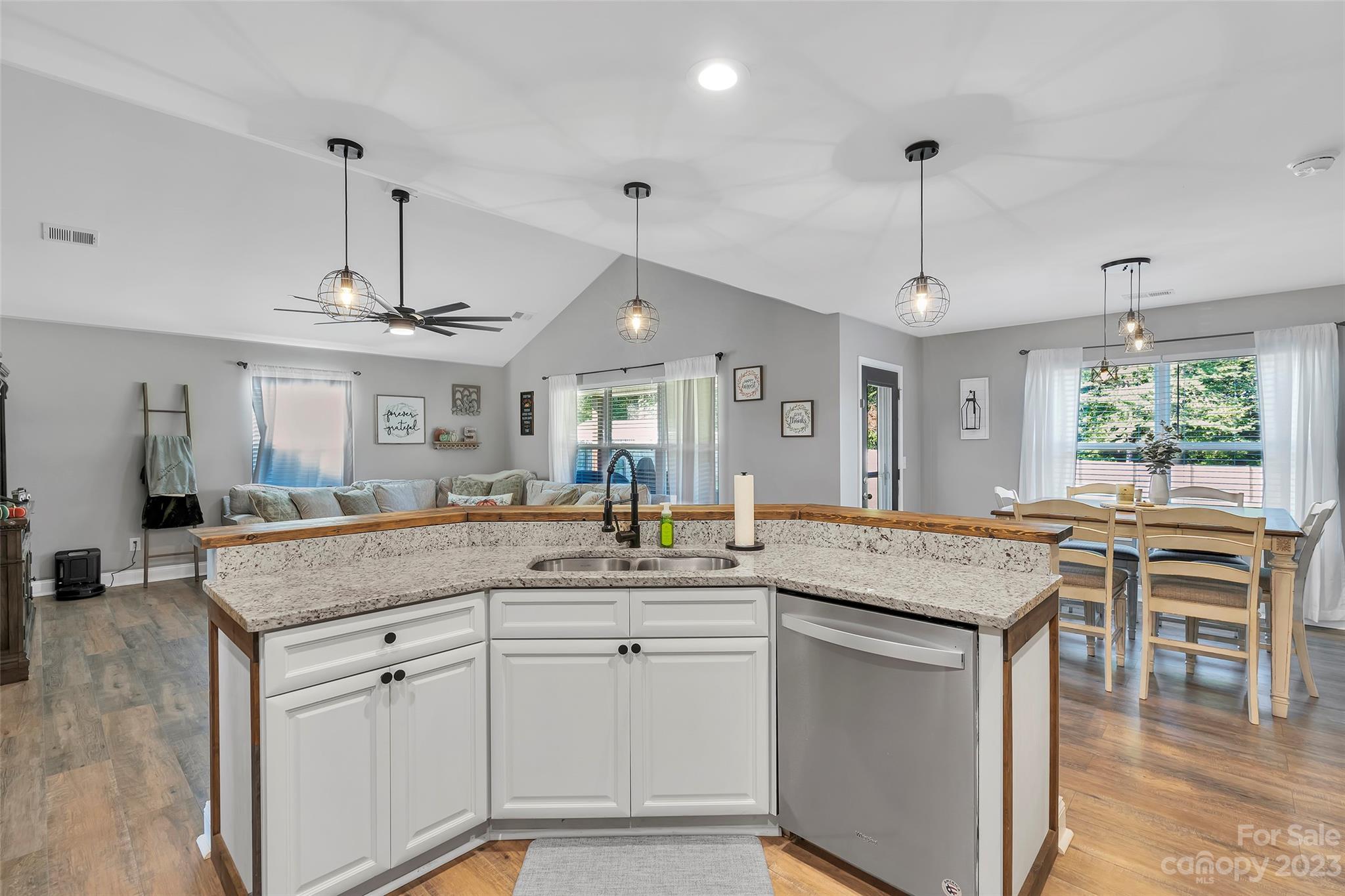 871 West Keepsake Lane Inman, SC 29349 - Photo 10 of 26 a kitchen with center island table and chairs