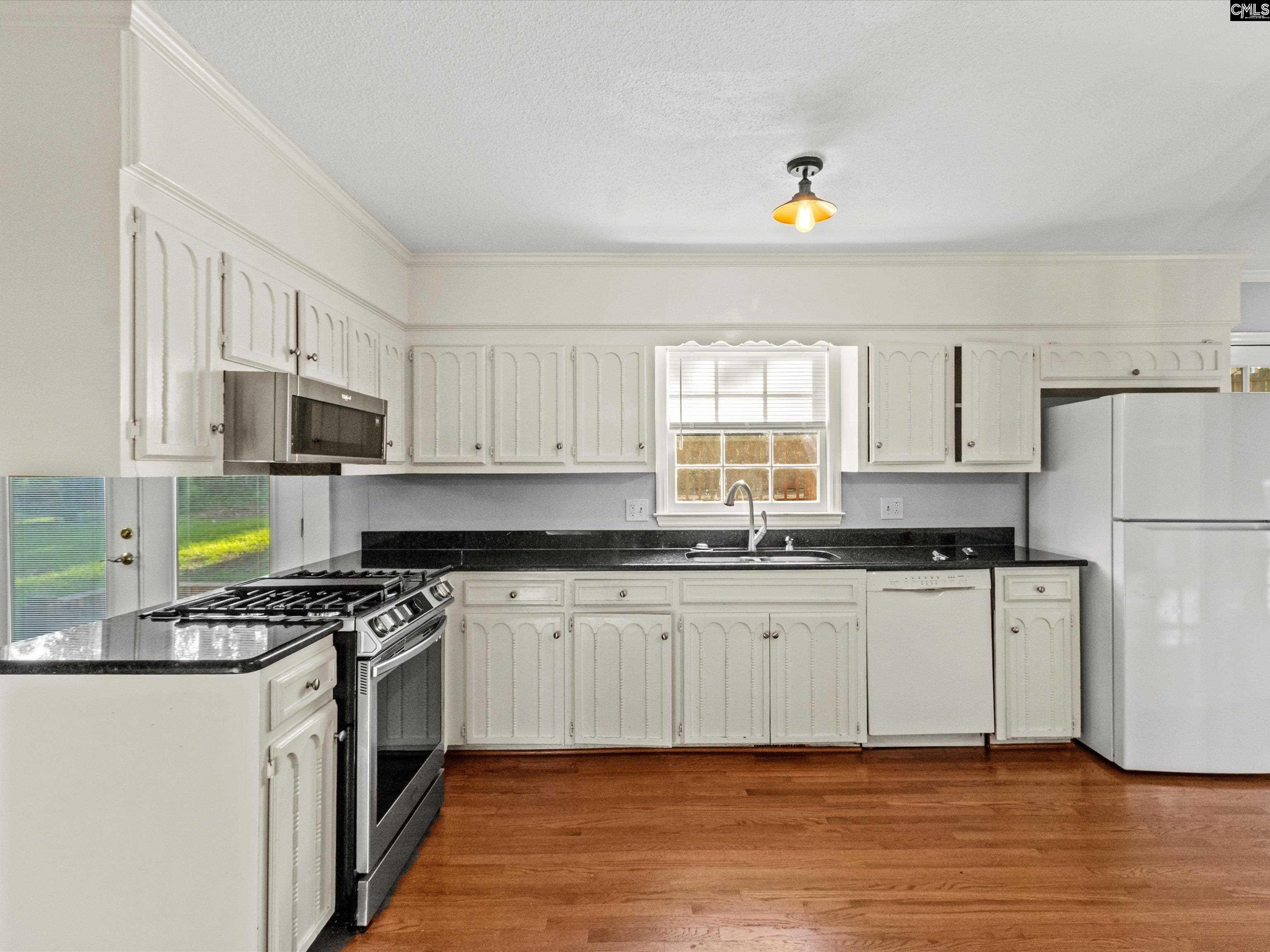 333 Lewisham Road Columbia, SC 29210 - Photo 13 of 35 a kitchen with stainless steel appliances granite countertop a stove a sink and a refrigerator