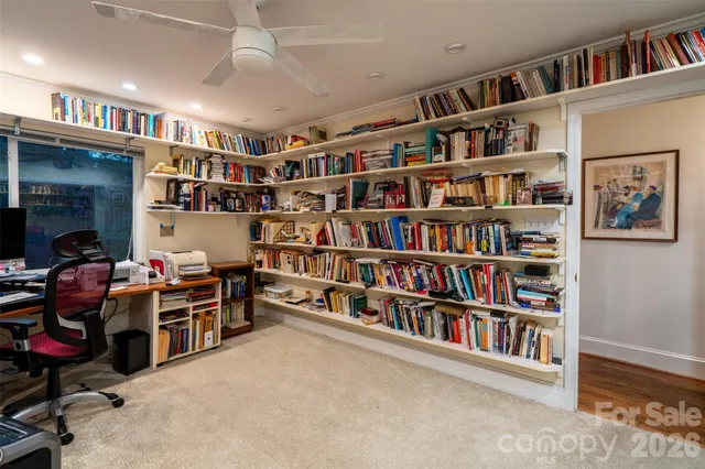 a bedroom with a large bed and a couch