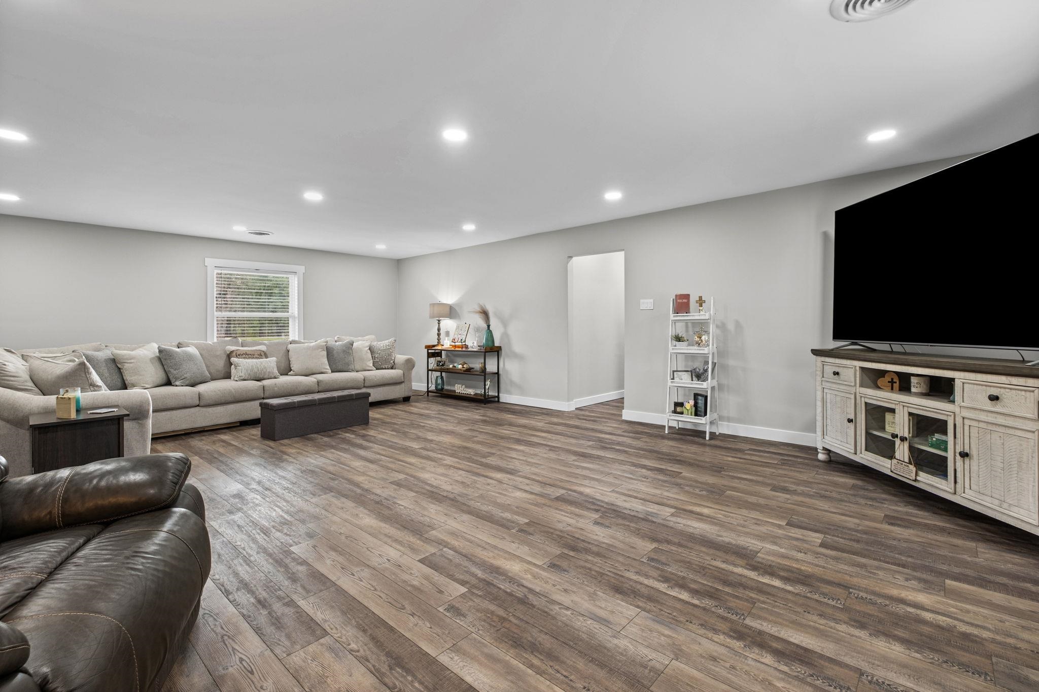 58 Hayes Road Munford, TN 38058 - Photo 17 of 40 Living area with dark wood-type flooring and recessed lighting