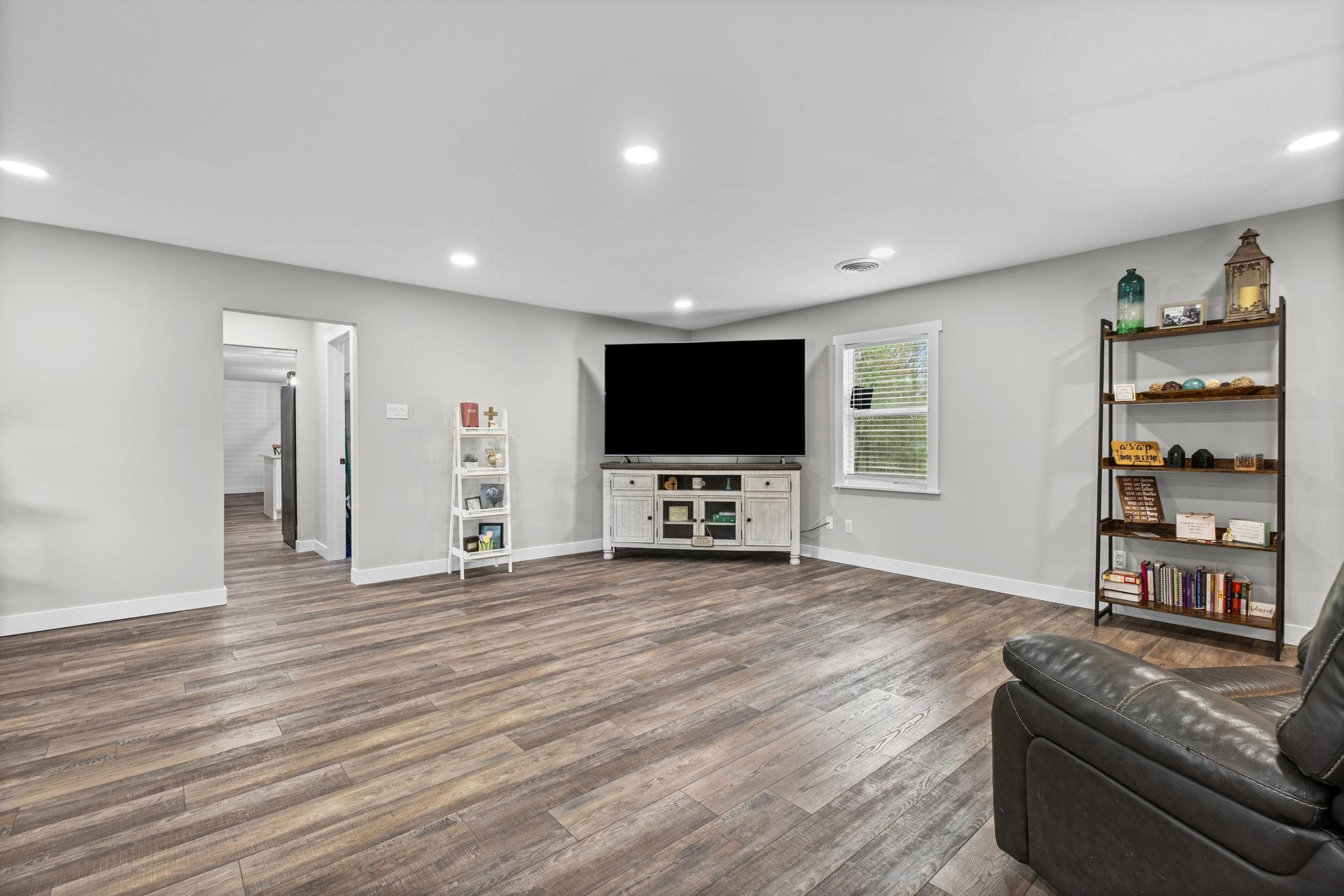 58 Hayes Road Munford, TN 38058 - Photo 19 of 40 Living room with dark wood-type flooring and recessed lighting