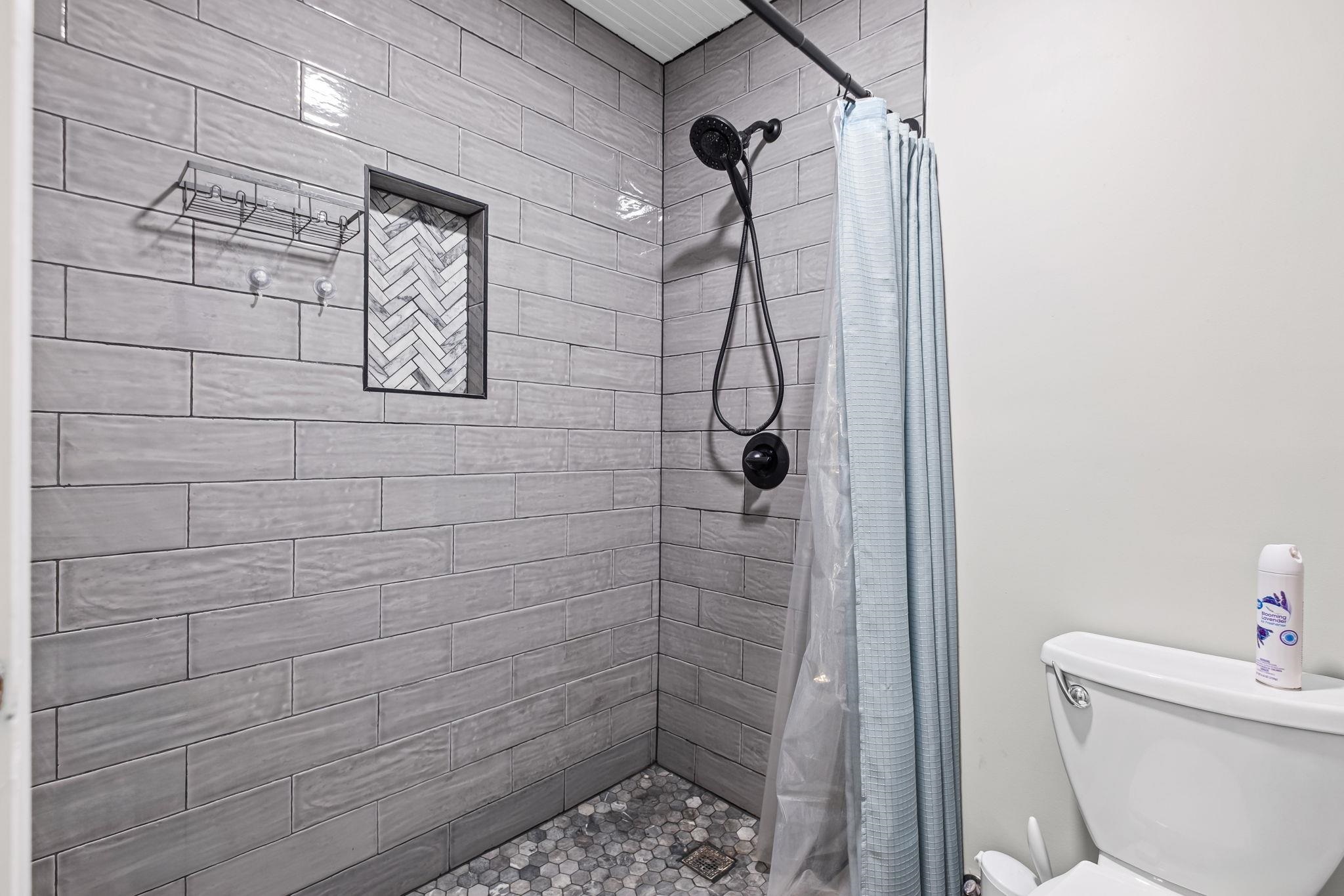 58 Hayes Road Munford, TN 38058 - Photo 26 of 40 Bathroom featuring a shower stall and toilet