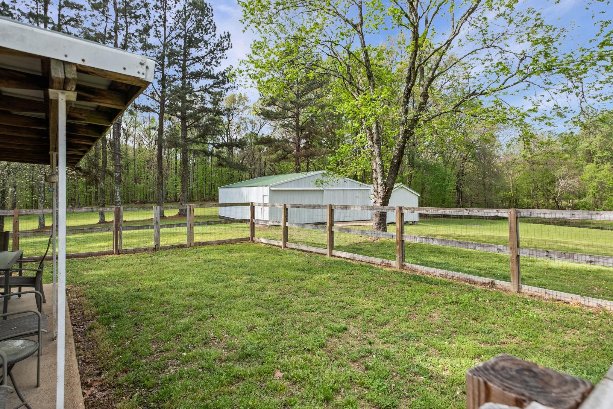 58 Hayes Road Munford, TN 38058 - Photo 31 of 40 View of yard with an outbuilding and a detached garage