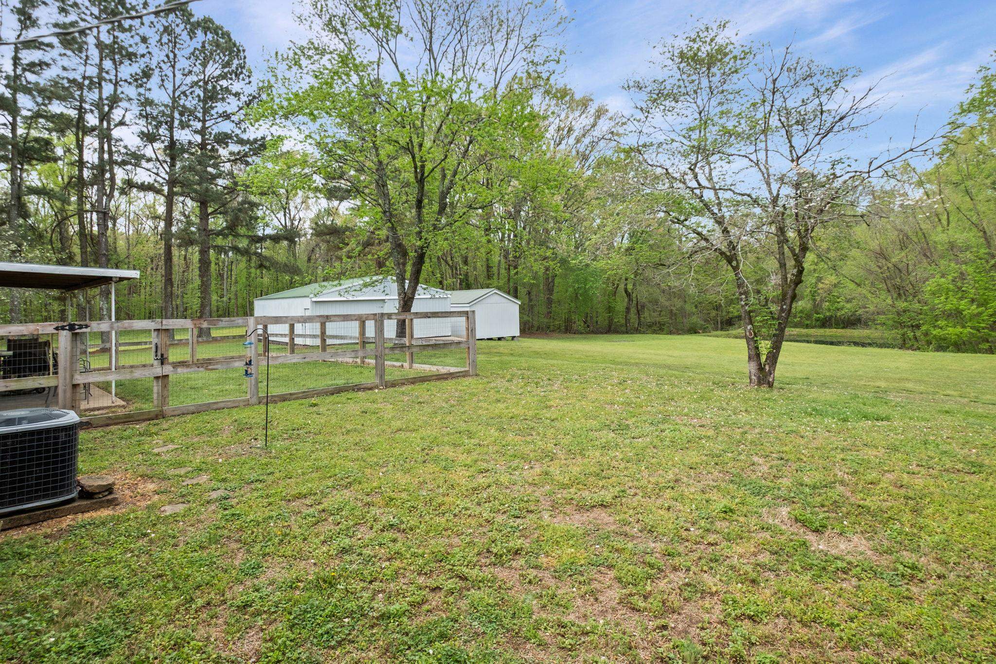 58 Hayes Road Munford, TN 38058 - Photo 32 of 40 View of green lawn featuring an outbuilding