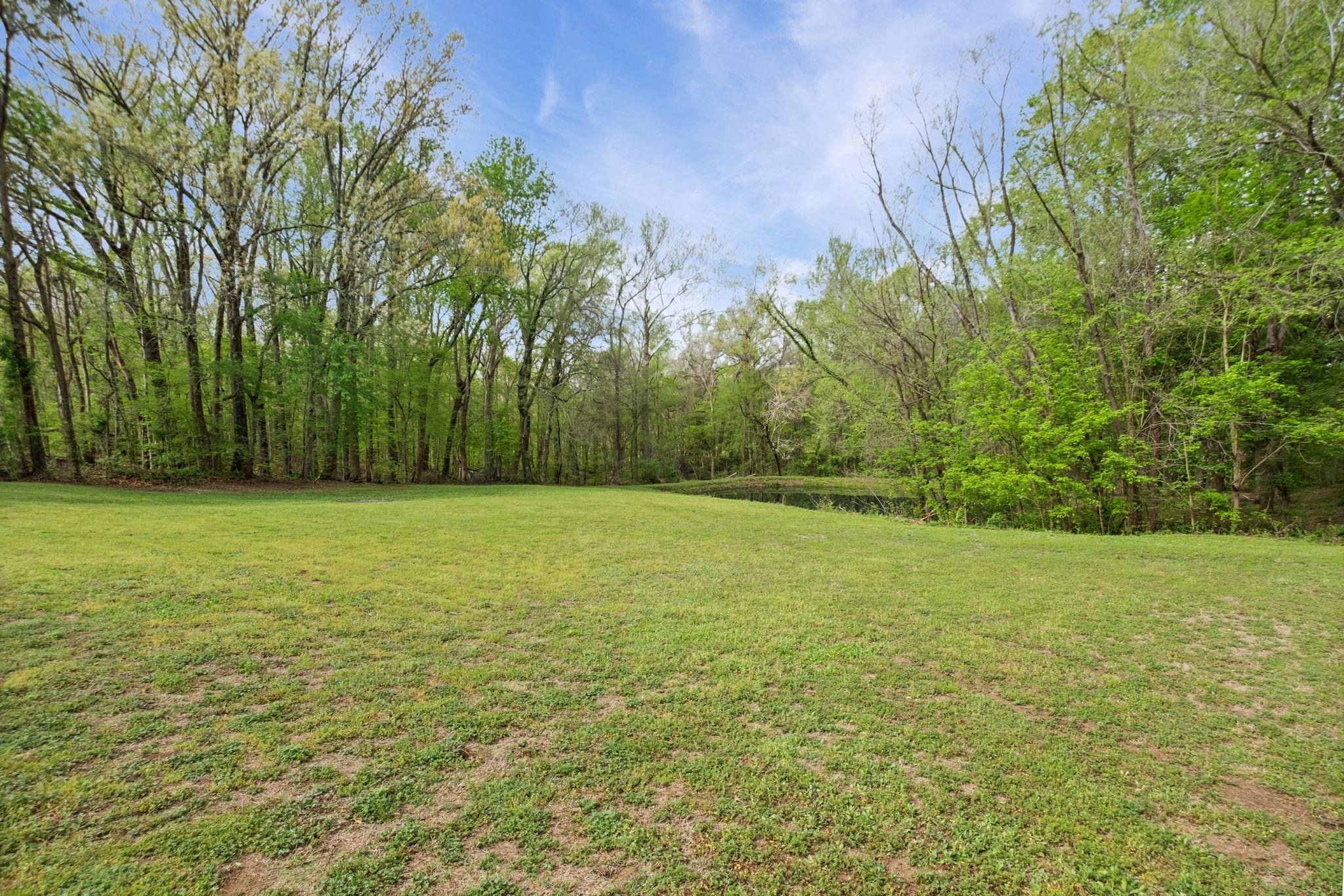 58 Hayes Road Munford, TN 38058 - Photo 34 of 40 View of grassy yard featuring a water view