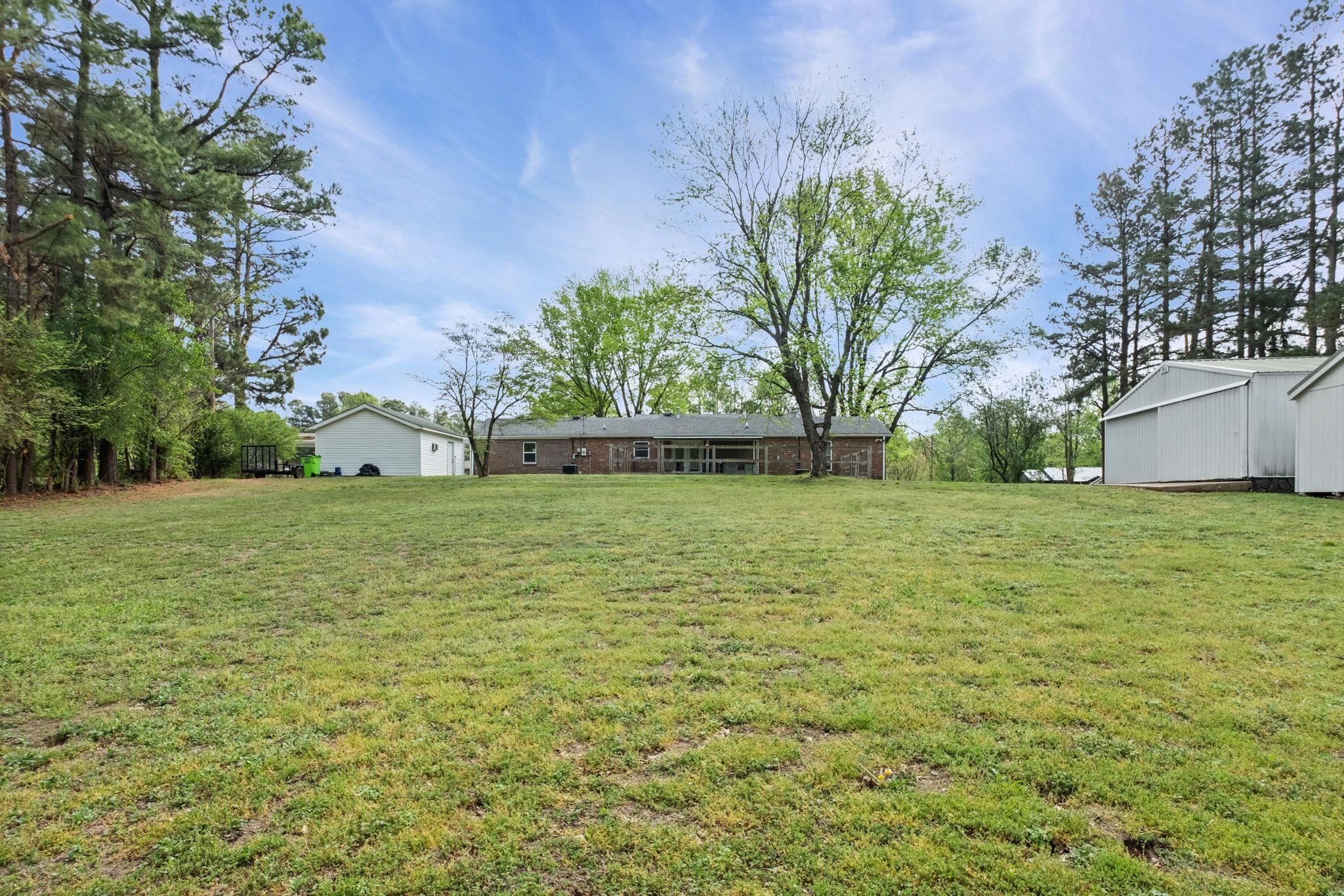 58 Hayes Road Munford, TN 38058 - Photo 35 of 40 View of green lawn featuring an outdoor structure