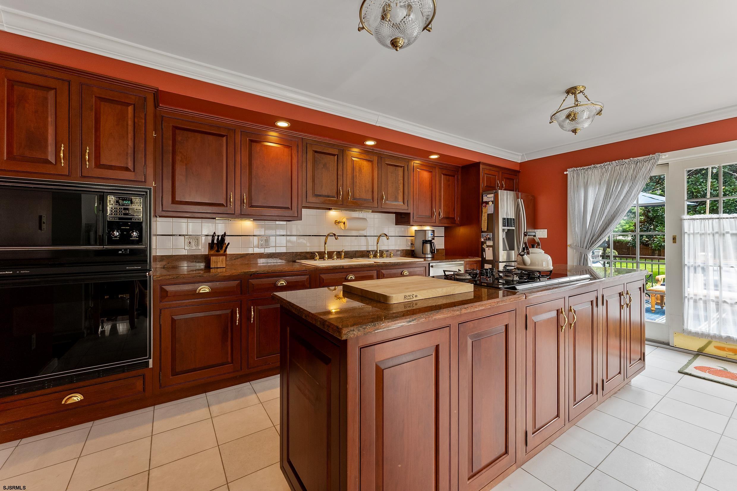 2024 Shore Road Linwood, NJ 08221 - Photo 25 of 51 a kitchen with granite countertop a sink stove and cabinets