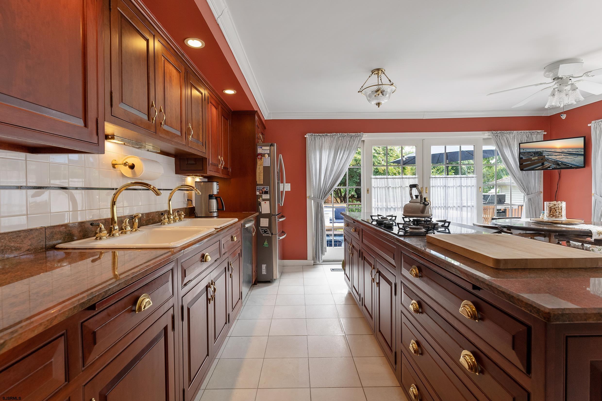 2024 Shore Road Linwood, NJ 08221 - Photo 26 of 51 a kitchen with stainless steel appliances a sink stove and cabinets