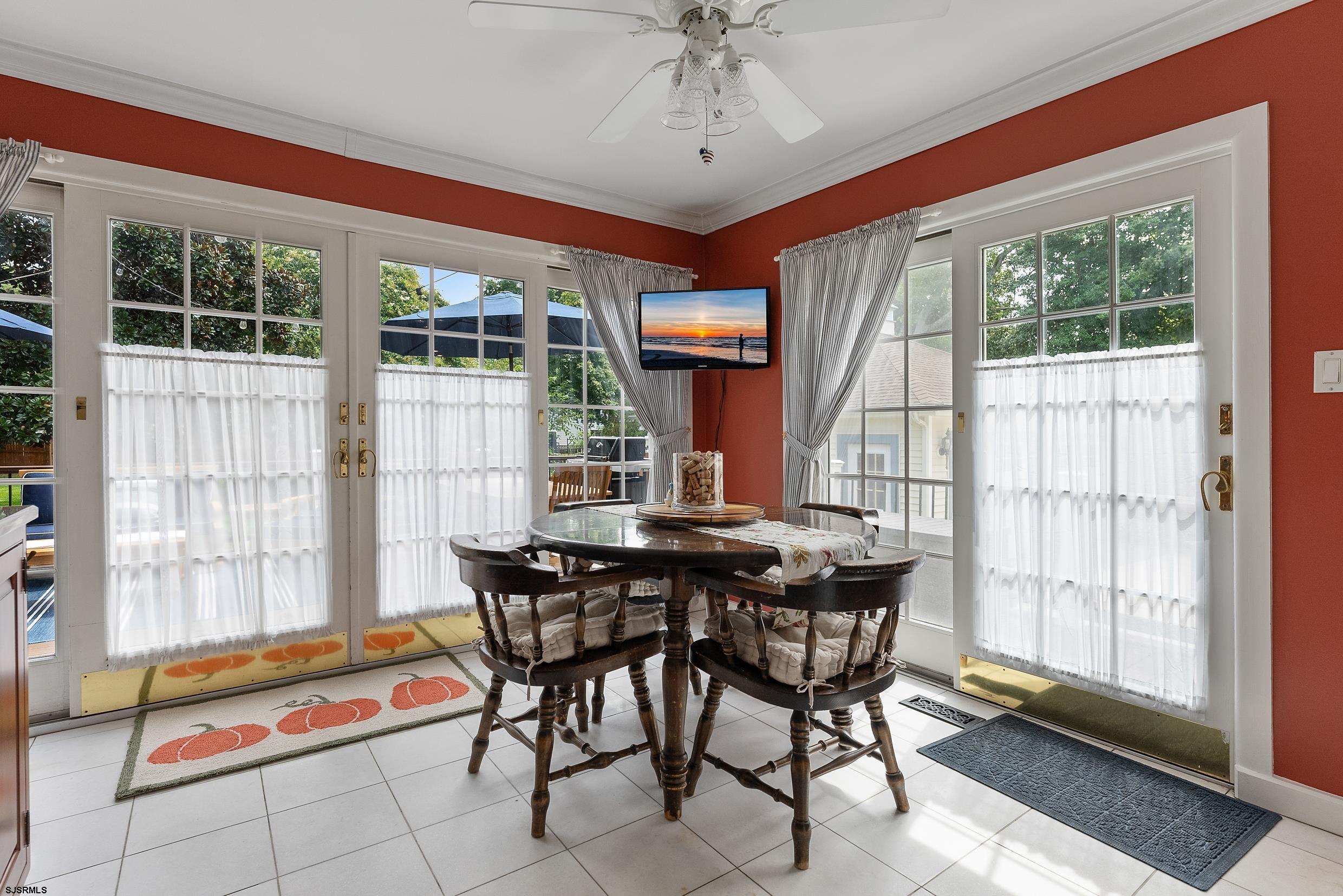 2024 Shore Road Linwood, NJ 08221 - Photo 27 of 51 a view of a dining room with furniture wooden floor and a chandelier