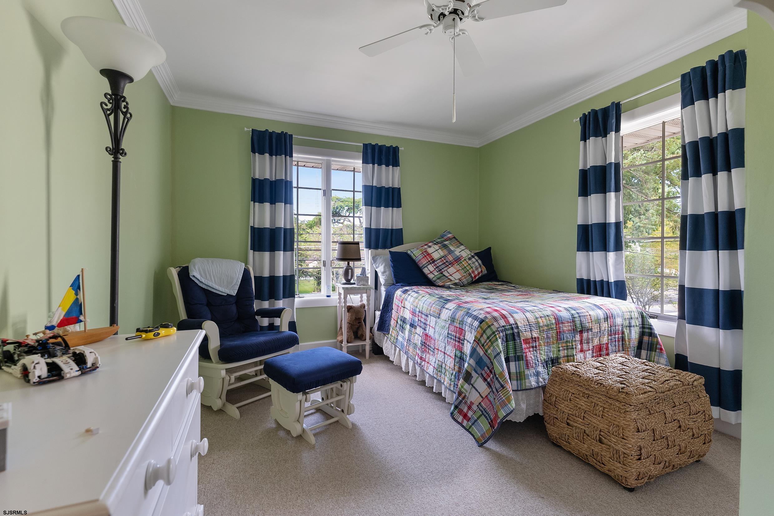2024 Shore Road Linwood, NJ 08221 - Photo 33 of 51 a bedroom with a bed gym equipment and a large window