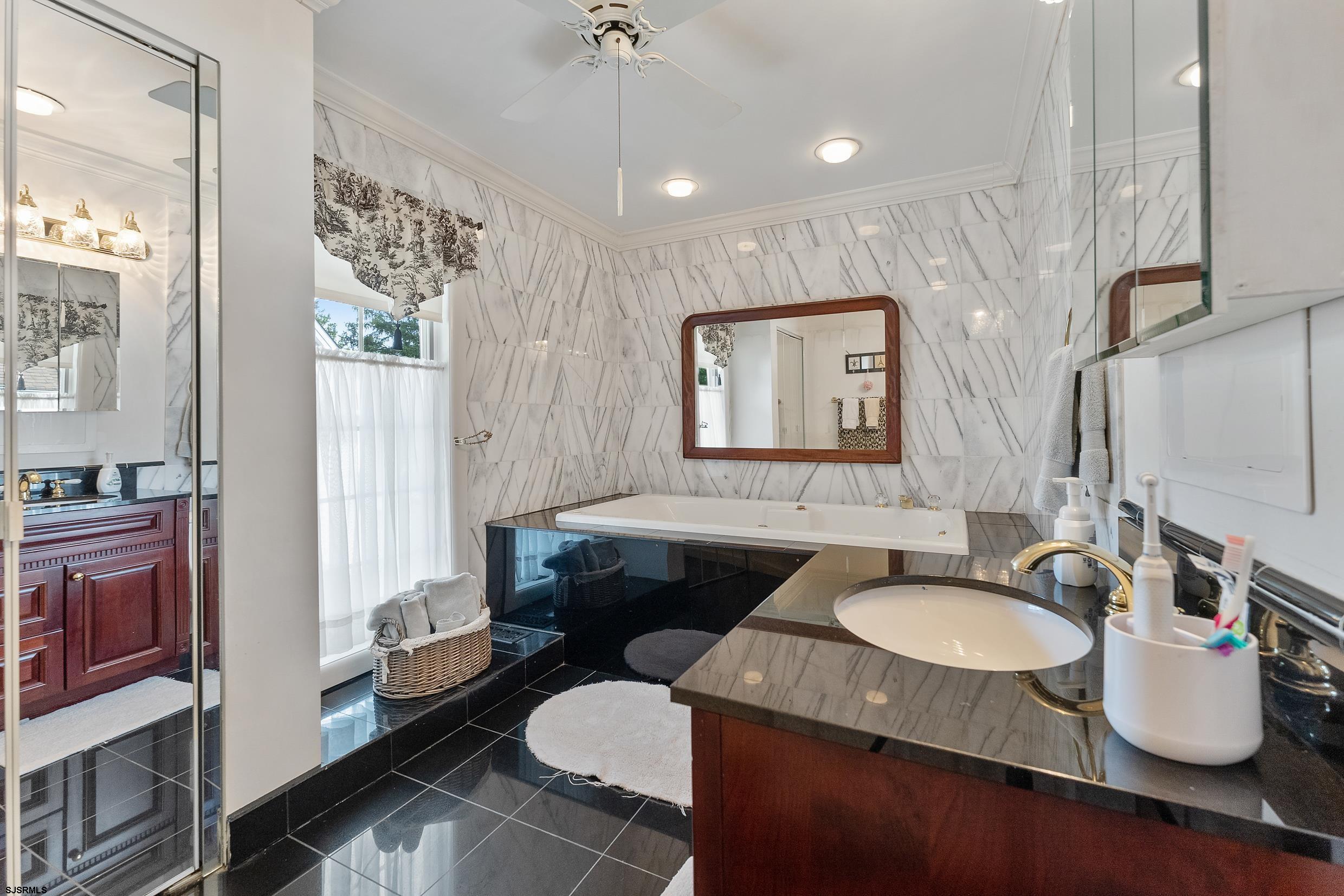 2024 Shore Road Linwood, NJ 08221 - Photo 34 of 51 a bathroom with a granite countertop sink and a mirror