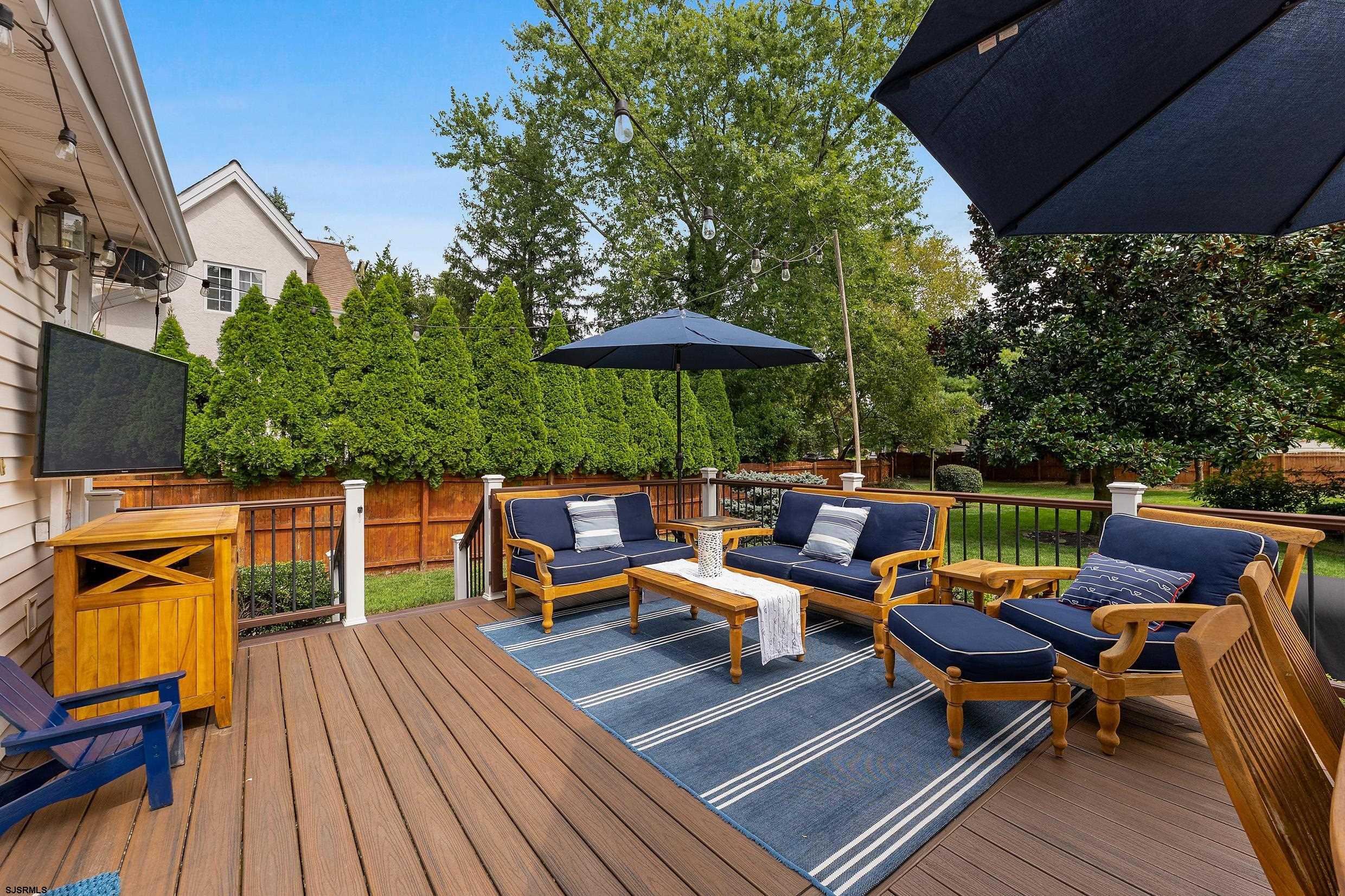 2024 Shore Road Linwood, NJ 08221 - Photo 39 of 51 an outdoor sitting area with furniture and wooden floor