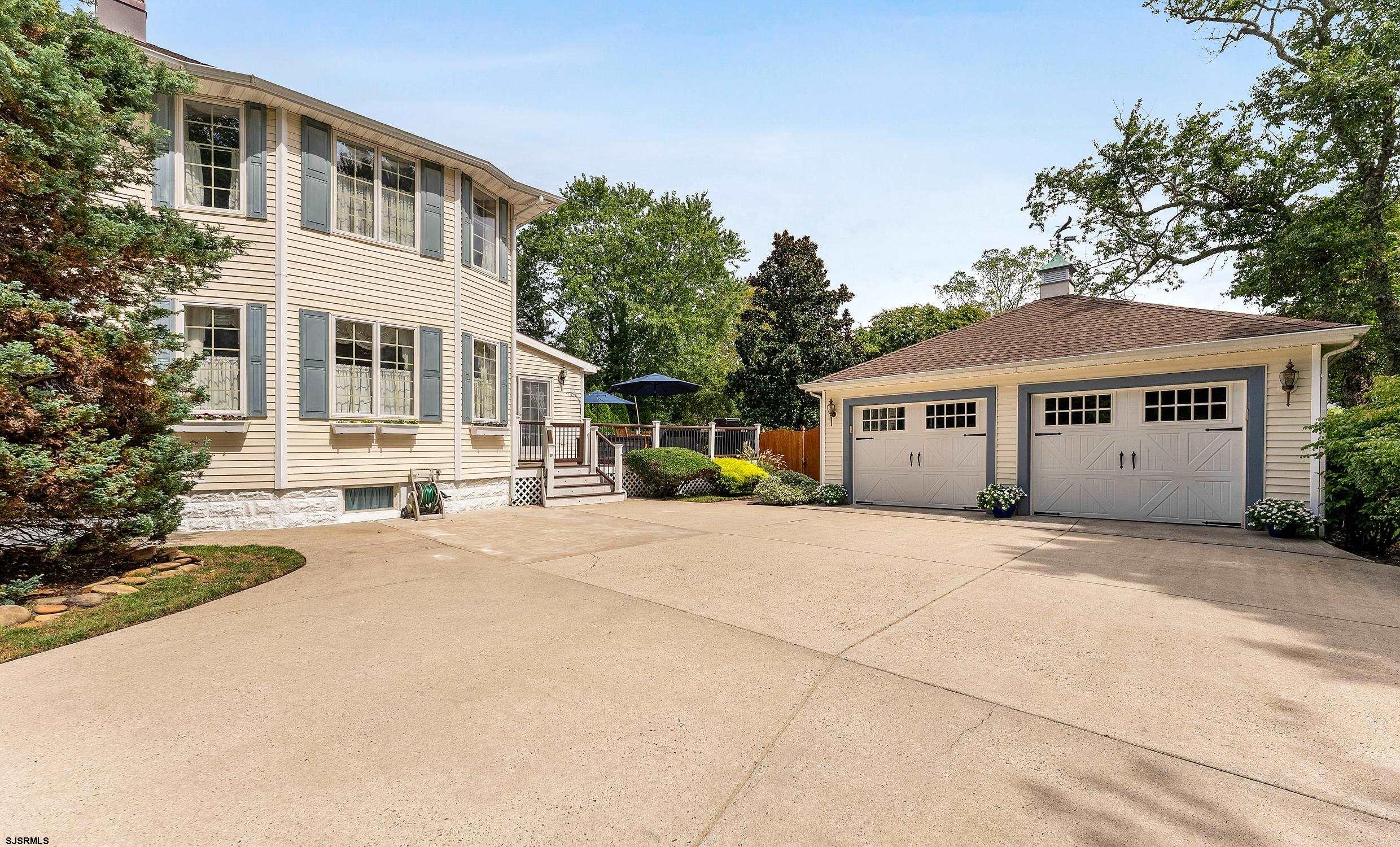 2024 Shore Road Linwood, NJ 08221 - Photo 4 of 51 a front view of a house with a garden