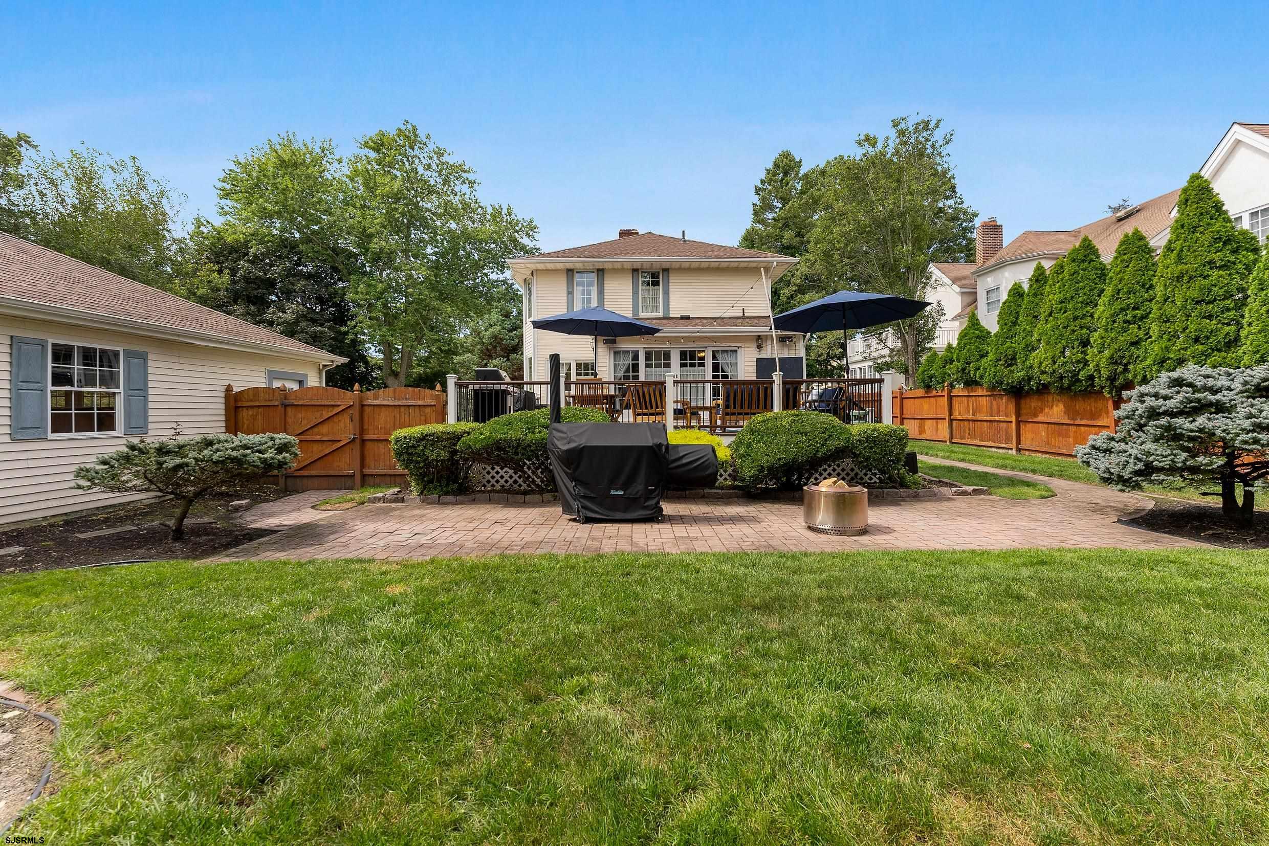 2024 Shore Road Linwood, NJ 08221 - Photo 41 of 51 a front view of house with yard and outdoor seating