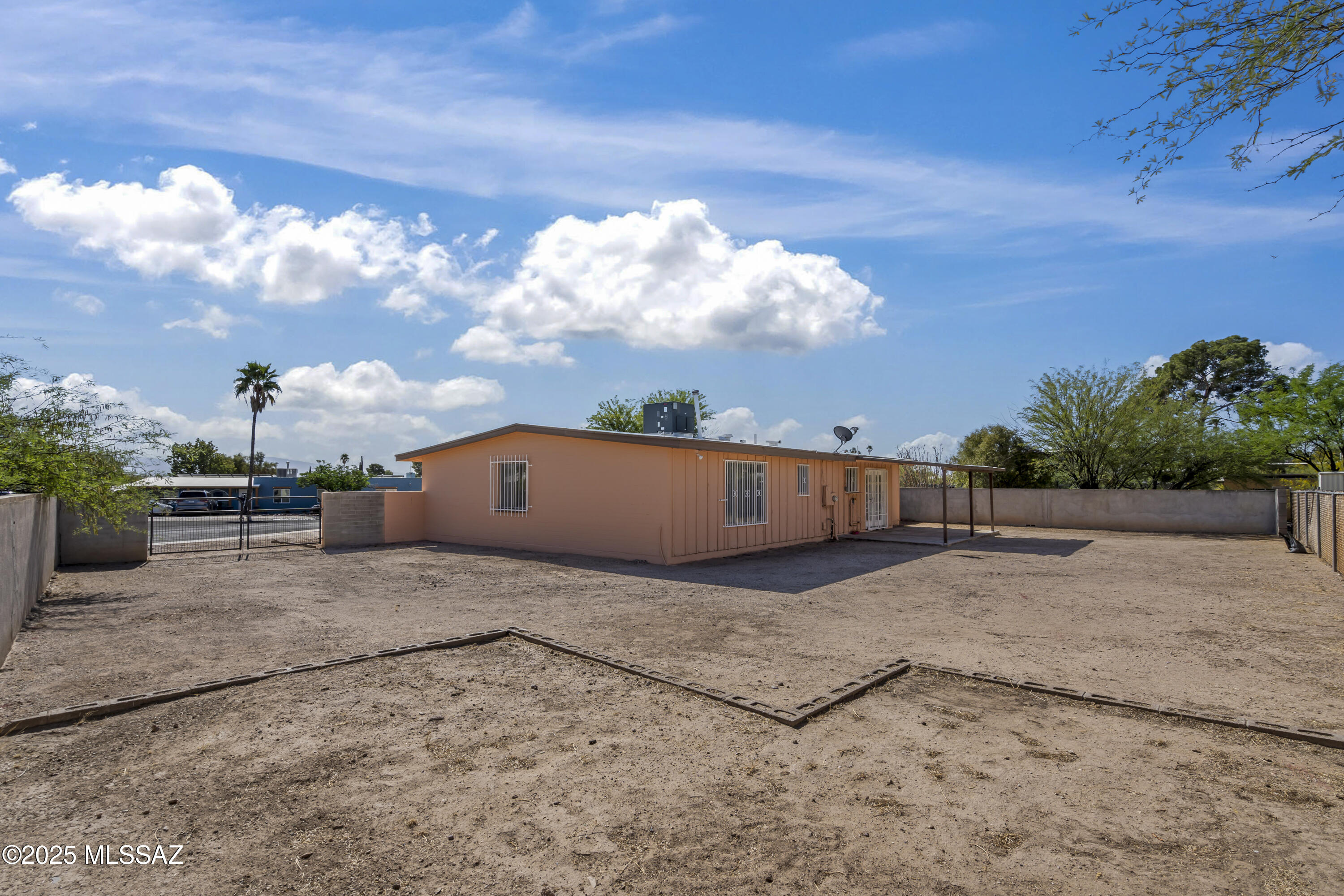 1926 West Saxony Road Tucson, AZ 85713 - Photo 5 of 26 a view of a dry yard with wooden fence