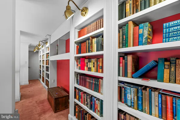 a kitchen with granite countertop a sink cabinets stainless steel appliances and a window