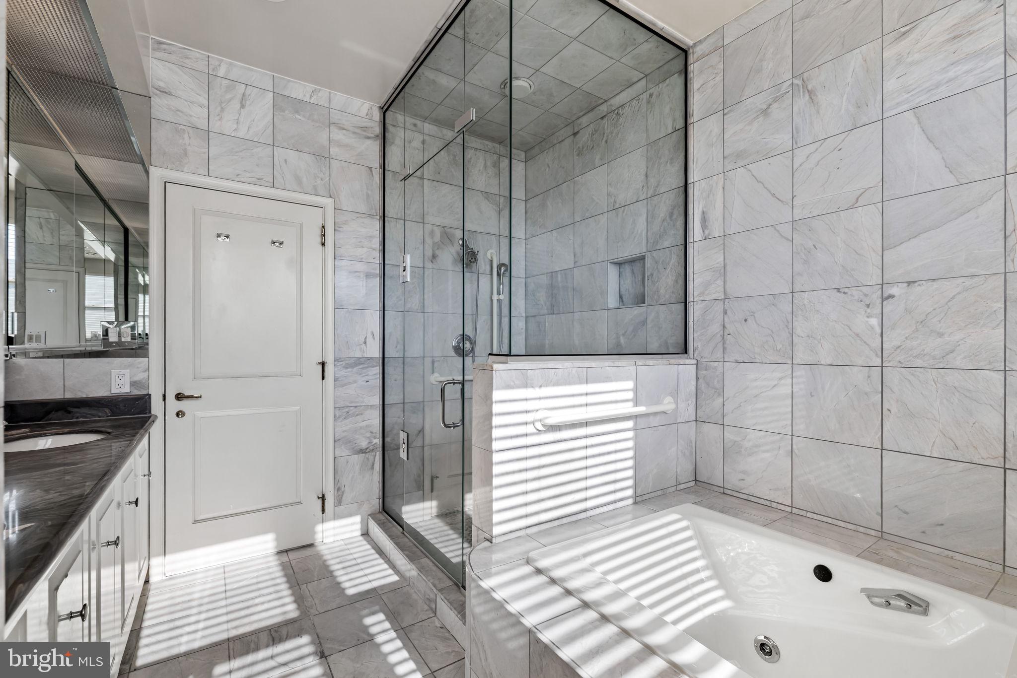 3801 Canterbury Road, Unit 1104 Baltimore, MD 21218 - Photo 32 of 74 a bathroom with a bathtub and shower