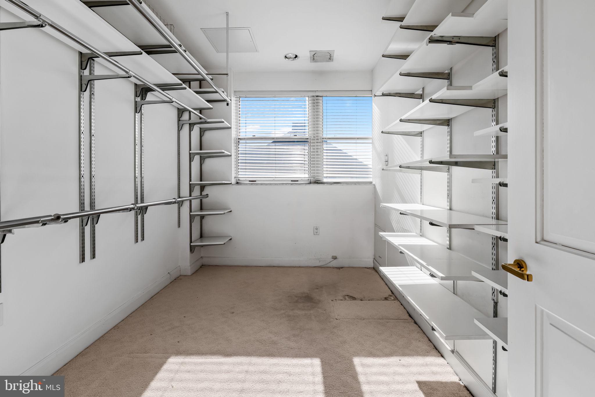 3801 Canterbury Road, Unit 1104 Baltimore, MD 21218 - Photo 39 of 74 a view of a room with racks on the wall
