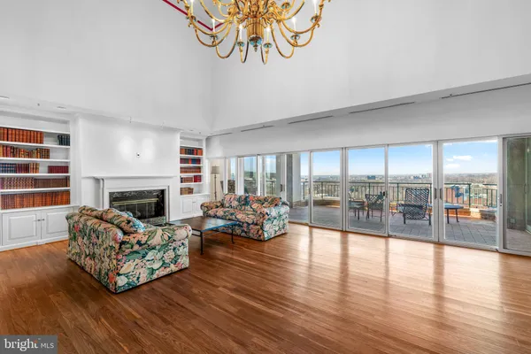 a living room with furniture fireplace and window