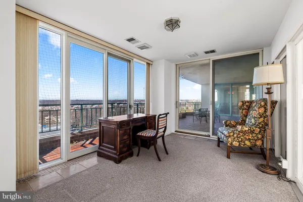 a view of livingroom with hardwood floor and a ceiling fan