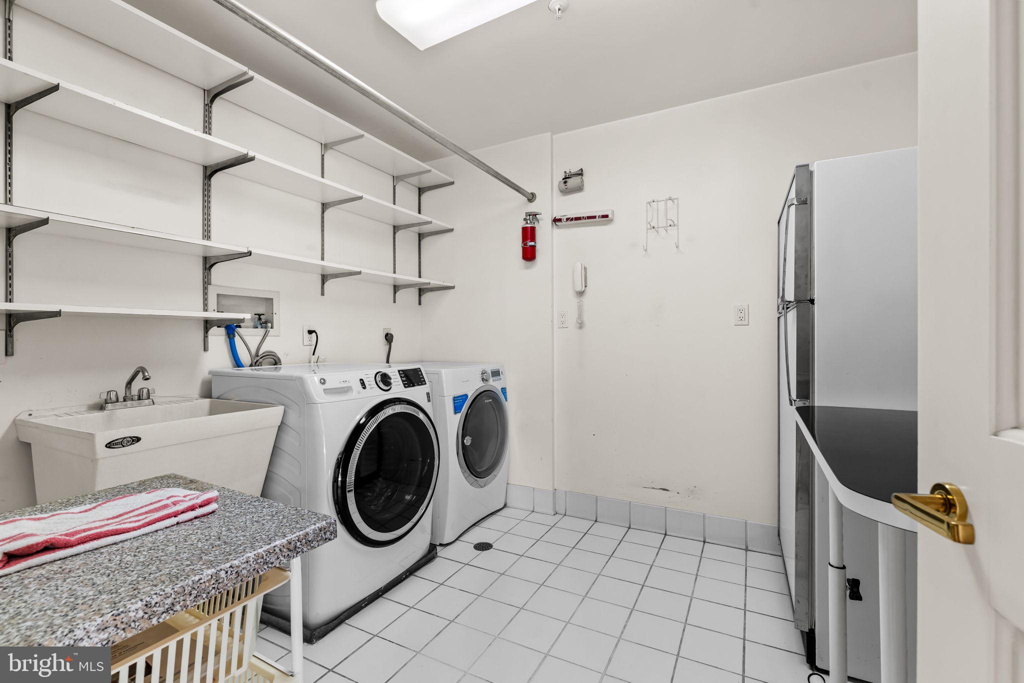 3801 Canterbury Road, Unit 1104 Baltimore, MD 21218 - Photo 48 of 74 a utility room with dryer and washer