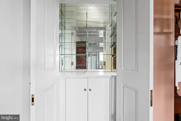 a view of a a dining room with furniture window and wooden floor