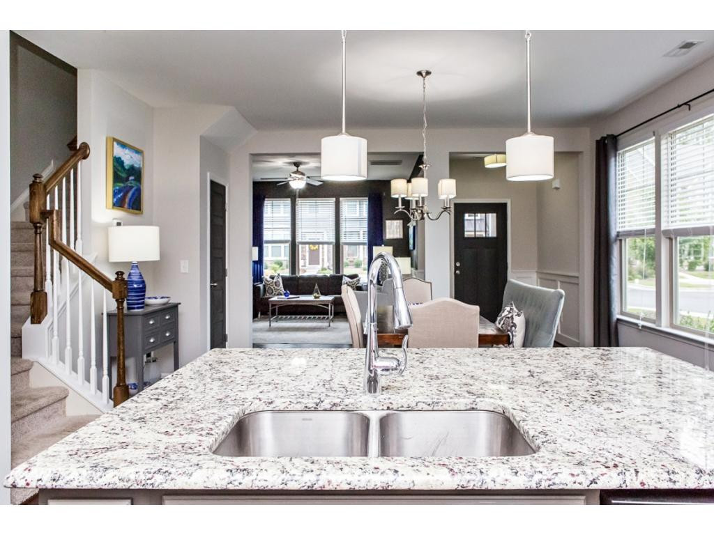 1014 Midtowne Way Durham, NC 27713 - Photo 11 of 24 a kitchen with kitchen island a sink stove and refrigerator