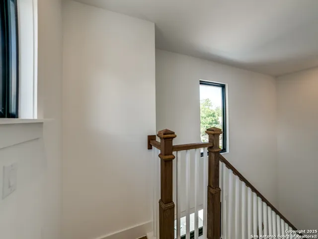 a view of a hallway with a chandelier