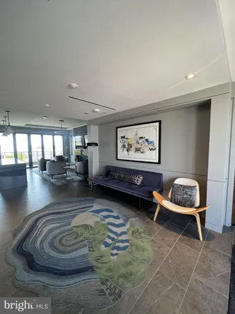 a living room with furniture and a rug