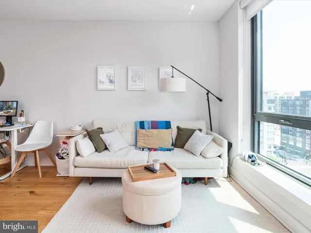 a view of a kitchen with workspace and furniture