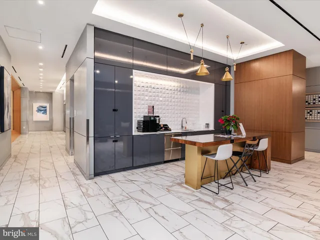 a living room with furniture a rug and a painting on the wall