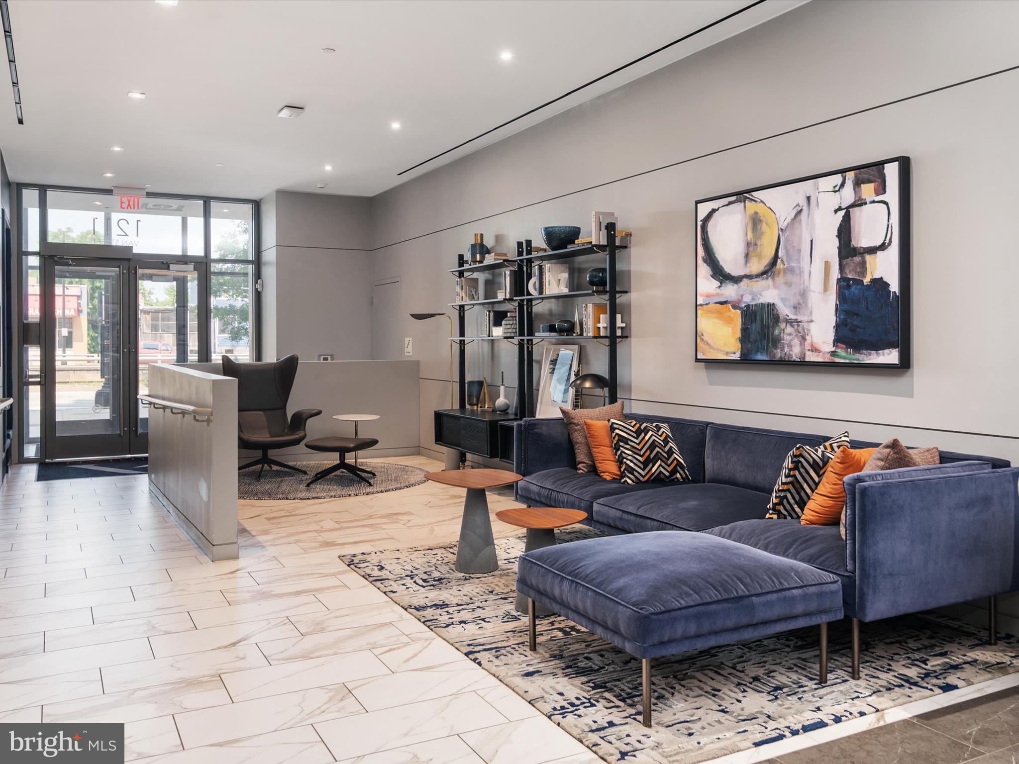1211 Van Street Southeast, Unit 1110 Washington, DC 20003 - Photo 35 of 46 a living room with furniture a rug and a painting on the wall