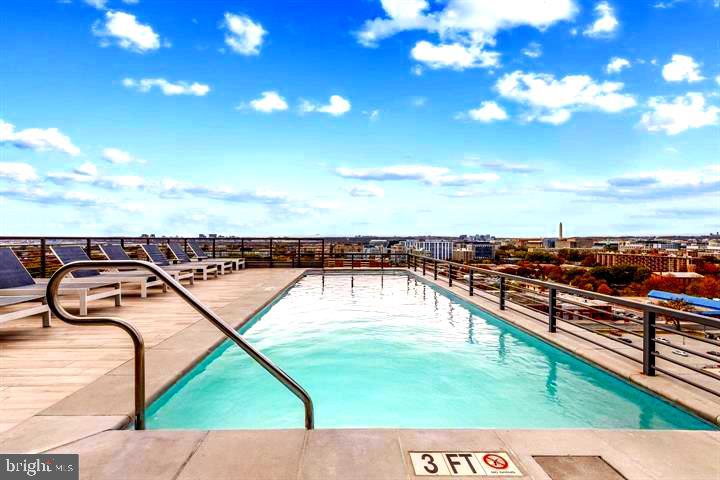 1211 Van Street Southeast, Unit 1110 Washington, DC 20003 - Photo 46 of 46 a view of a swimming pool with a patio