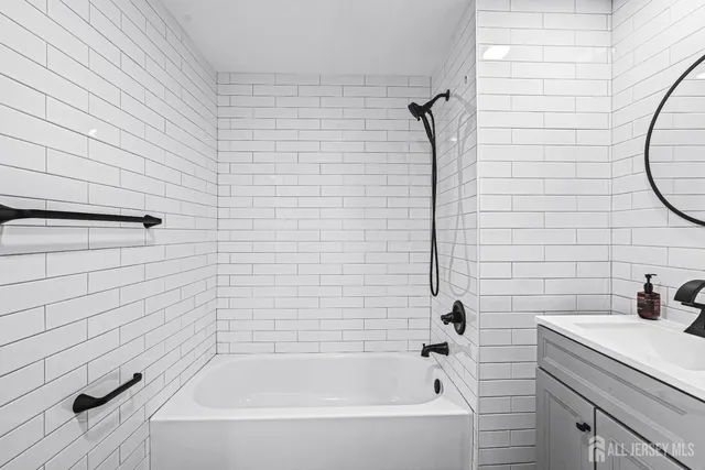 a bathroom with a shower and a bathtub